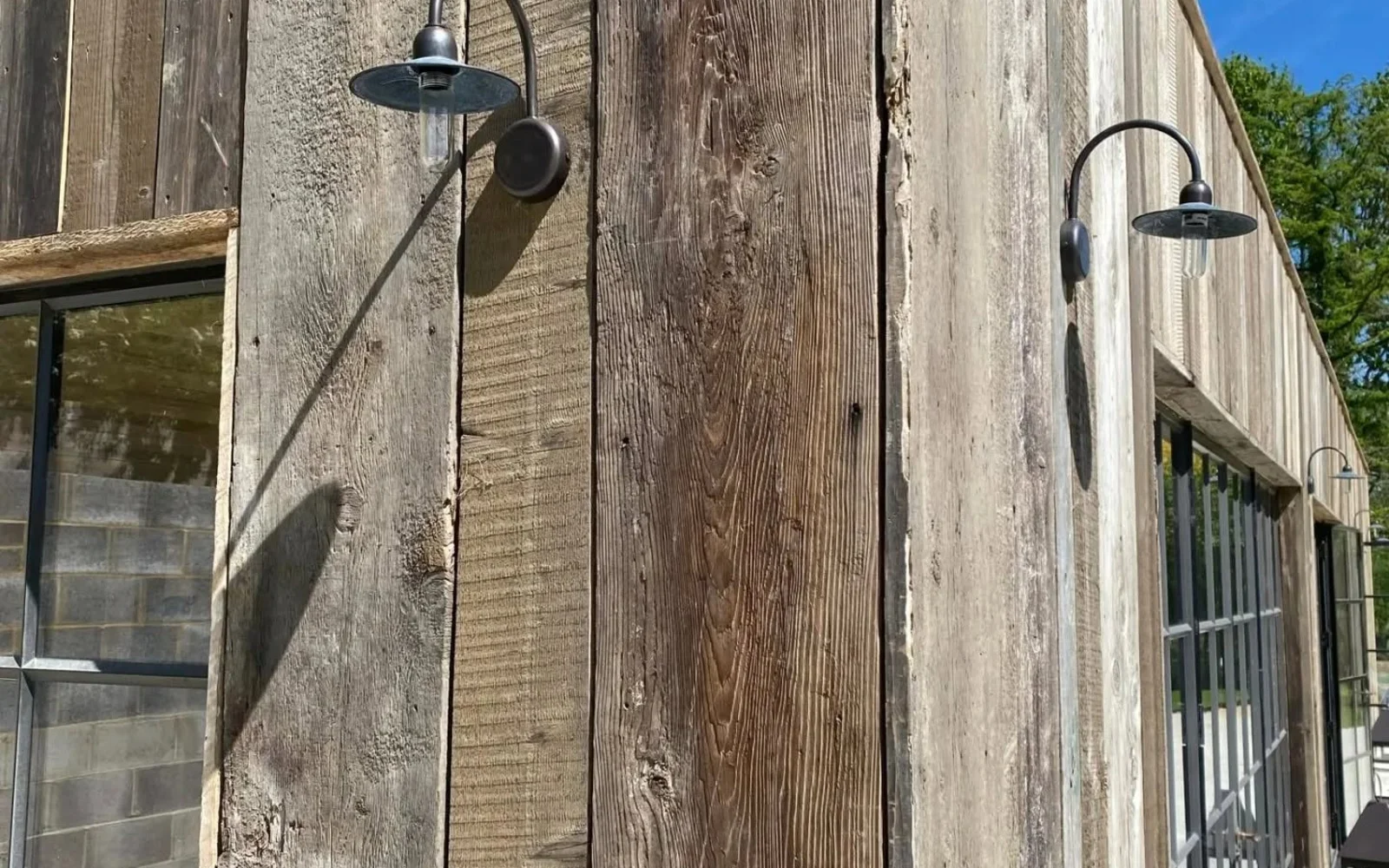 Lights on the side of a wood building