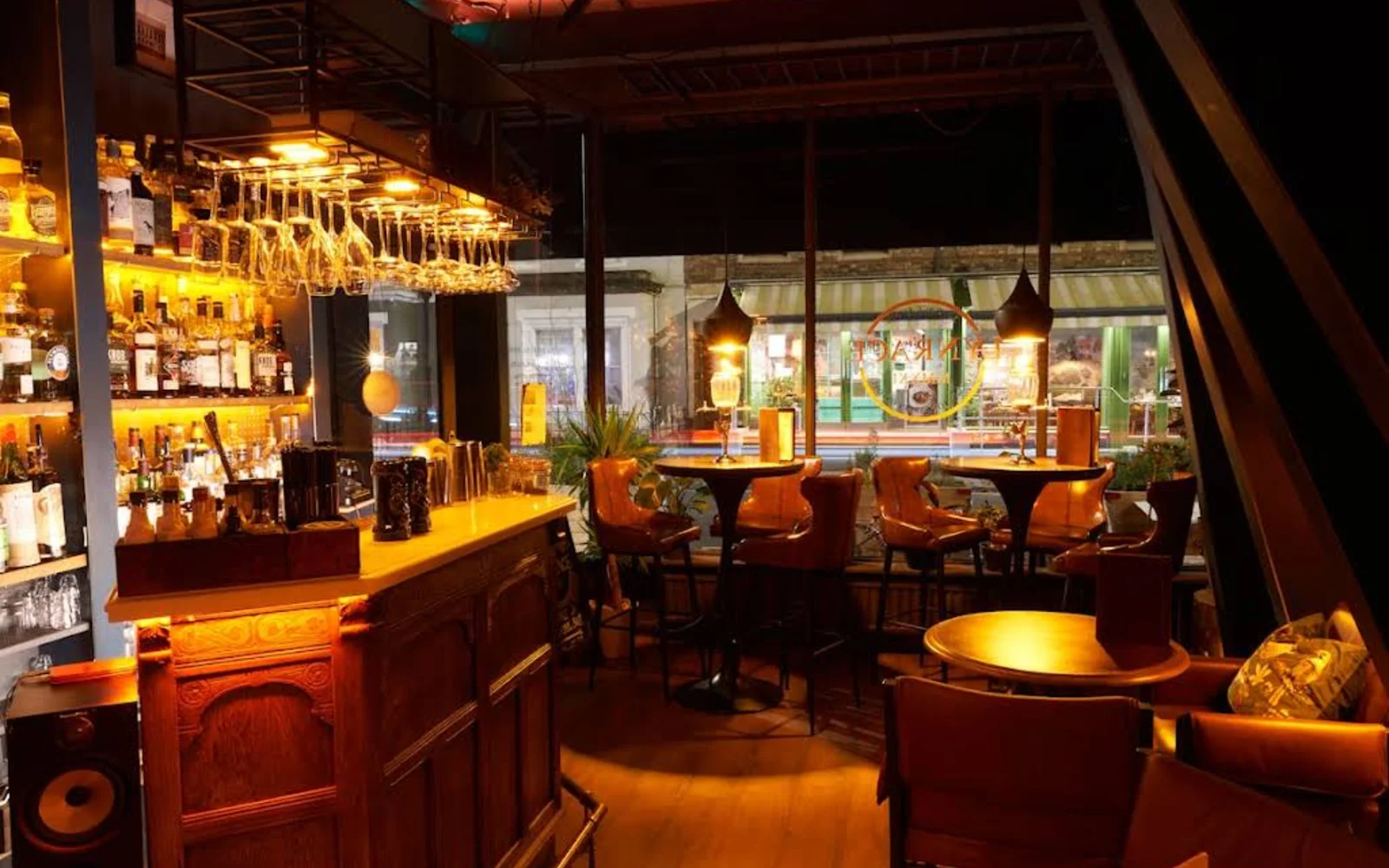 Lynrace bar oxford chairs and table with bottles on shelves 