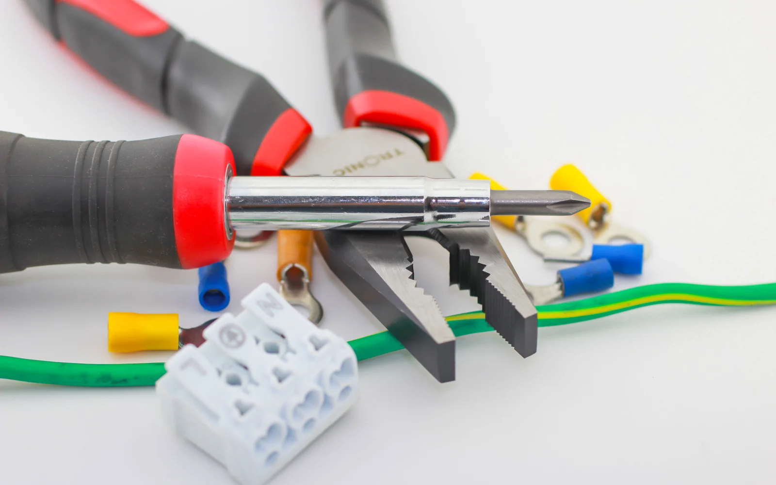pliers and a screwdrivers on a table 