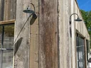 Lights on the side of a wood building